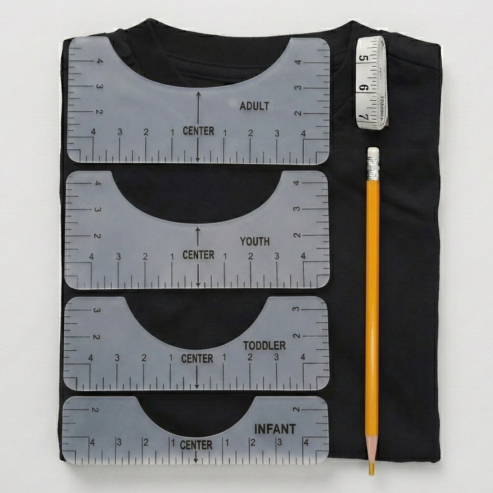6-piece T-shirt alignment ruler guide set placed on a shirt collar to perfectly center a DTF transfer for adult, youth, and toddler sizes.