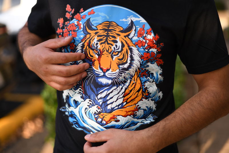 Customer wearing a custom DTF transfer shirt printed by DTFSheet