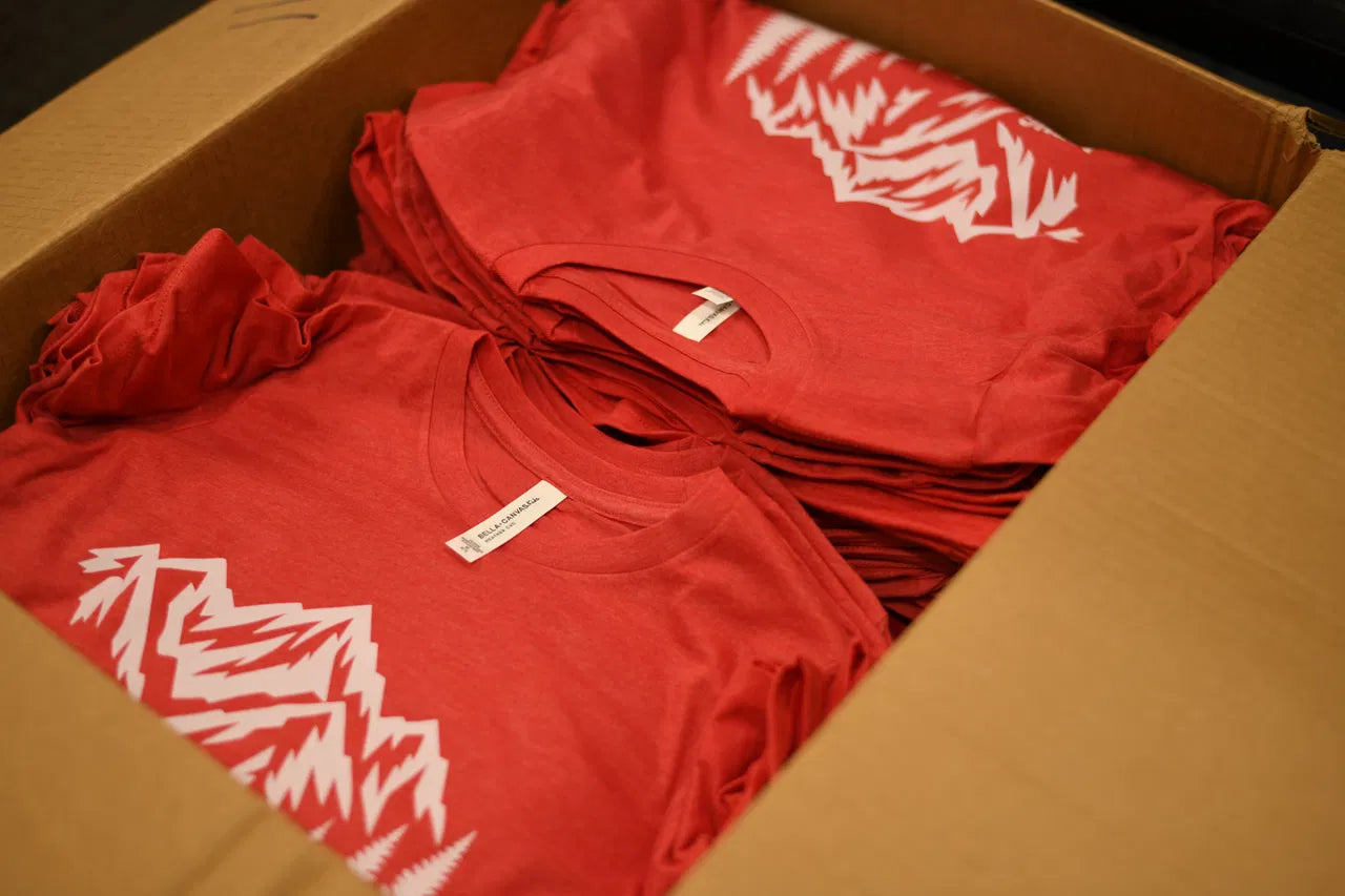 Custom printed shirts packed together after a DTFSheet order