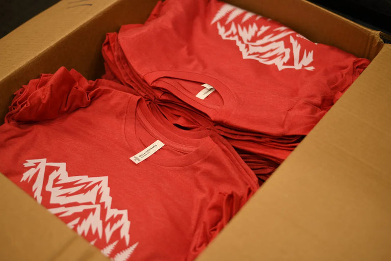 Custom printed shirts packed together after a DTFSheet order