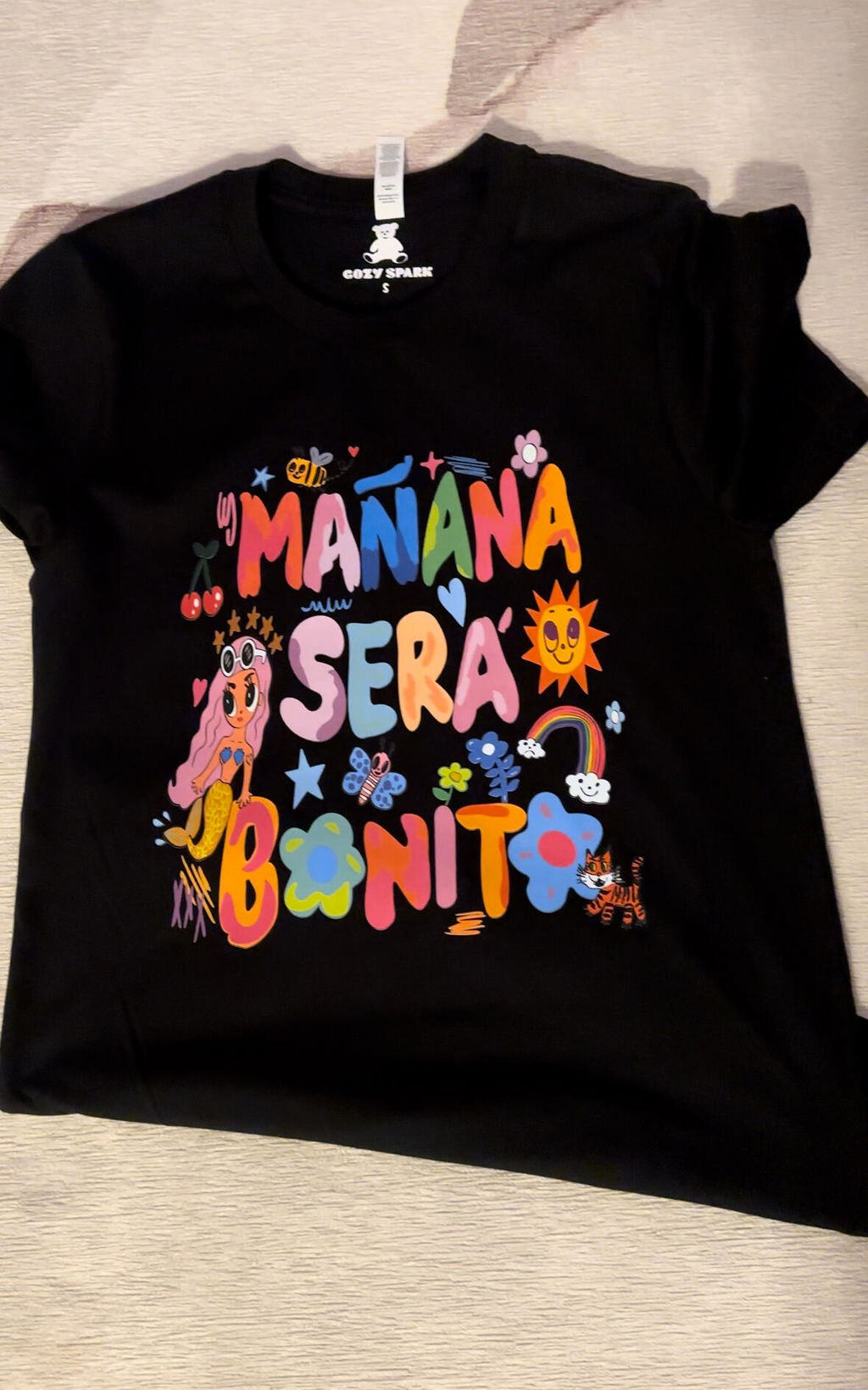 Black shirt with bright multicolor lettering printed from a customer design