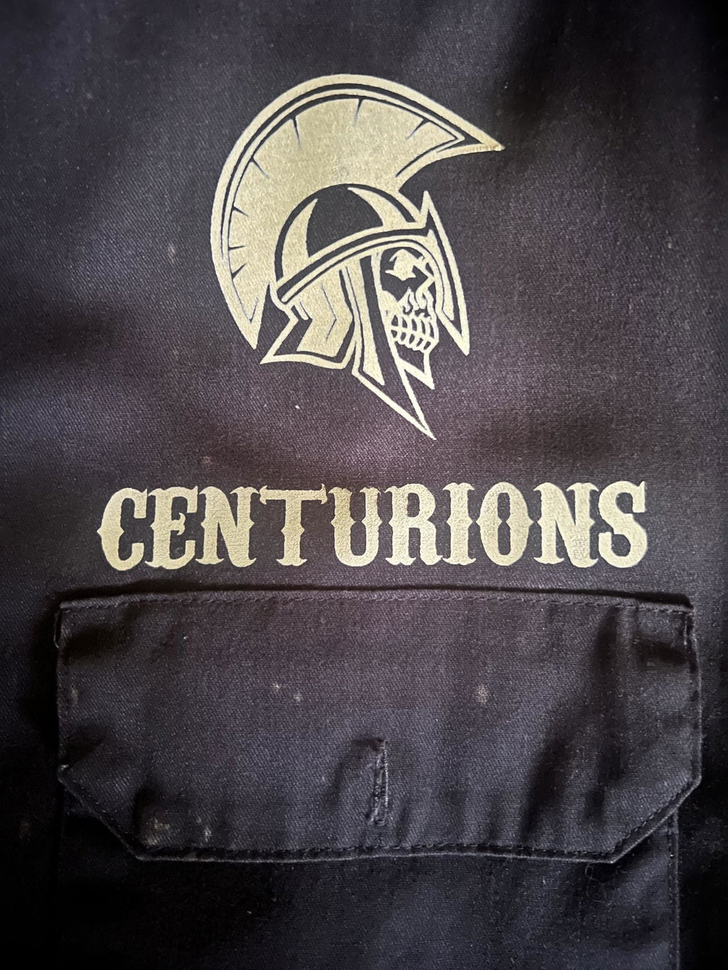 Fine helmet lines and lettering on a customer work shirt