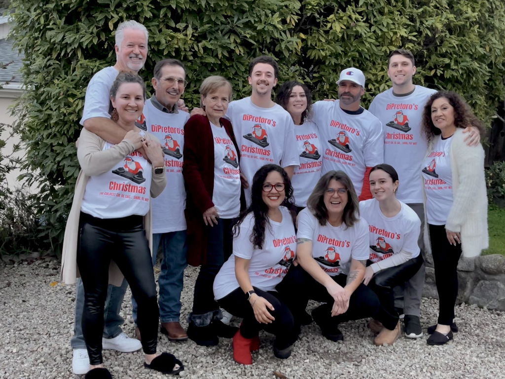 Family wearing matching white Christmas shirts made with DTFSheet transfers