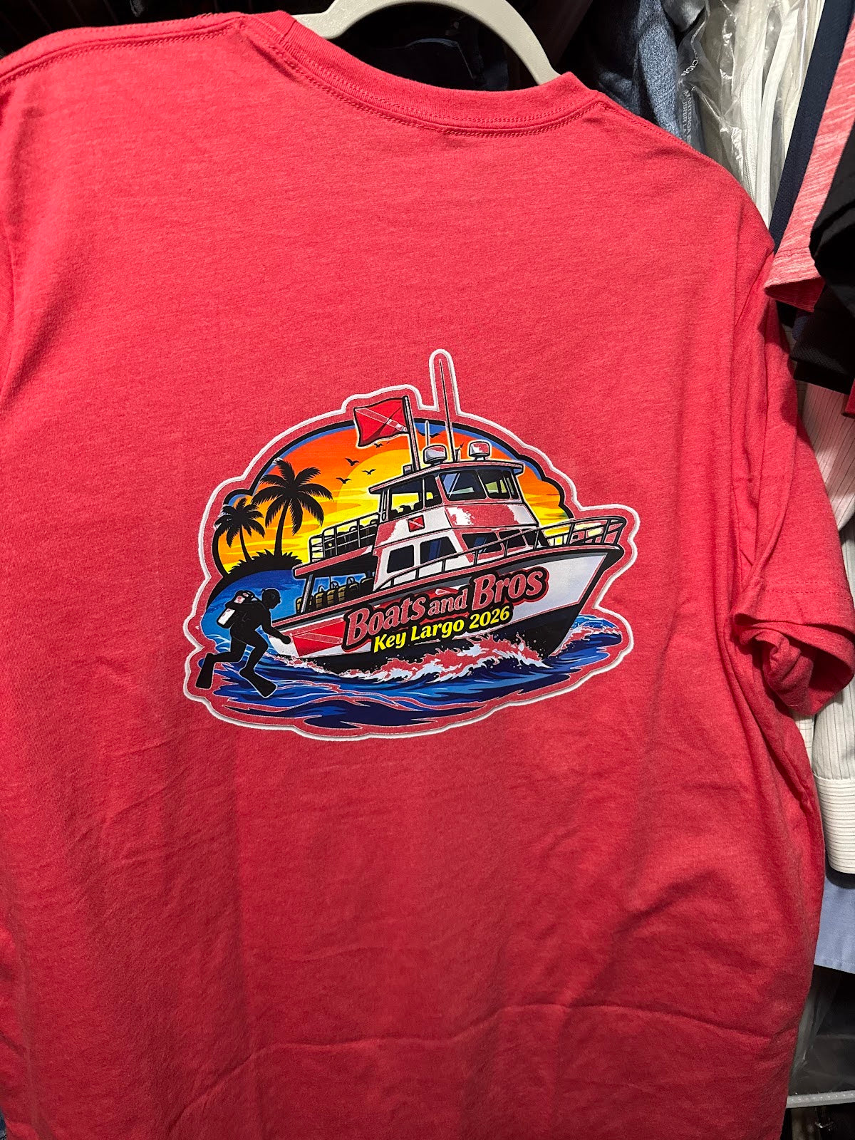 Bright red shirt with a vivid multicolor boat transfer