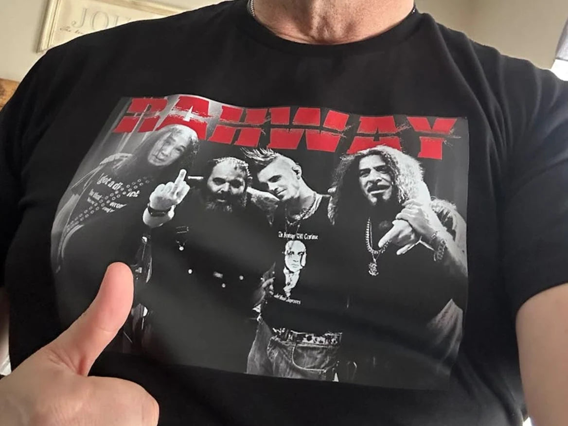 A customer holding up a shirt to show the printed placement