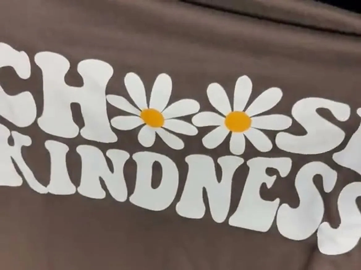 A Choose Kindness print flexing with its fabric
