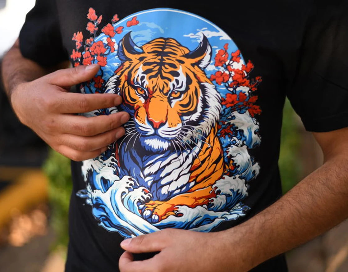 A full-color tiger transfer on a finished black shirt, shown as a print example; apparel is not included
